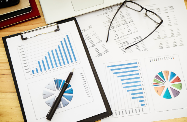 Desk with statistical tables and a clipboard